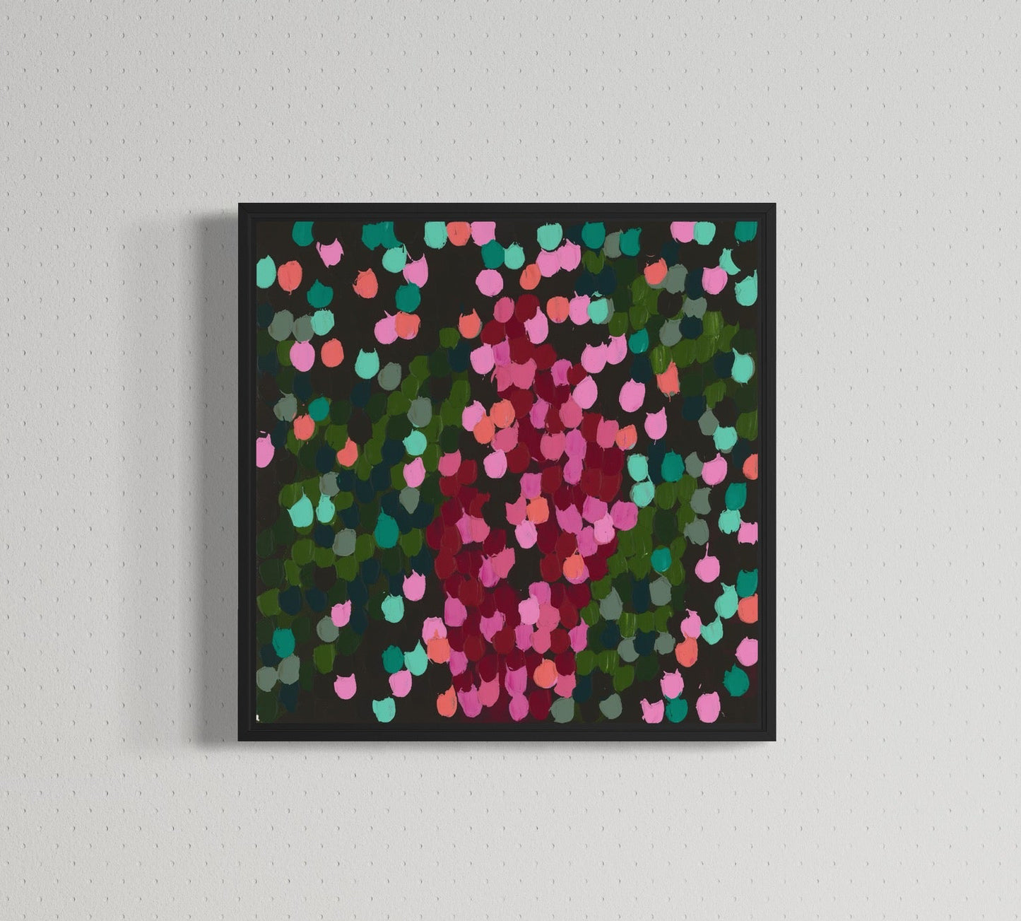 Colorful abstract painting on a wall above a wooden cabinet with a decorative object.