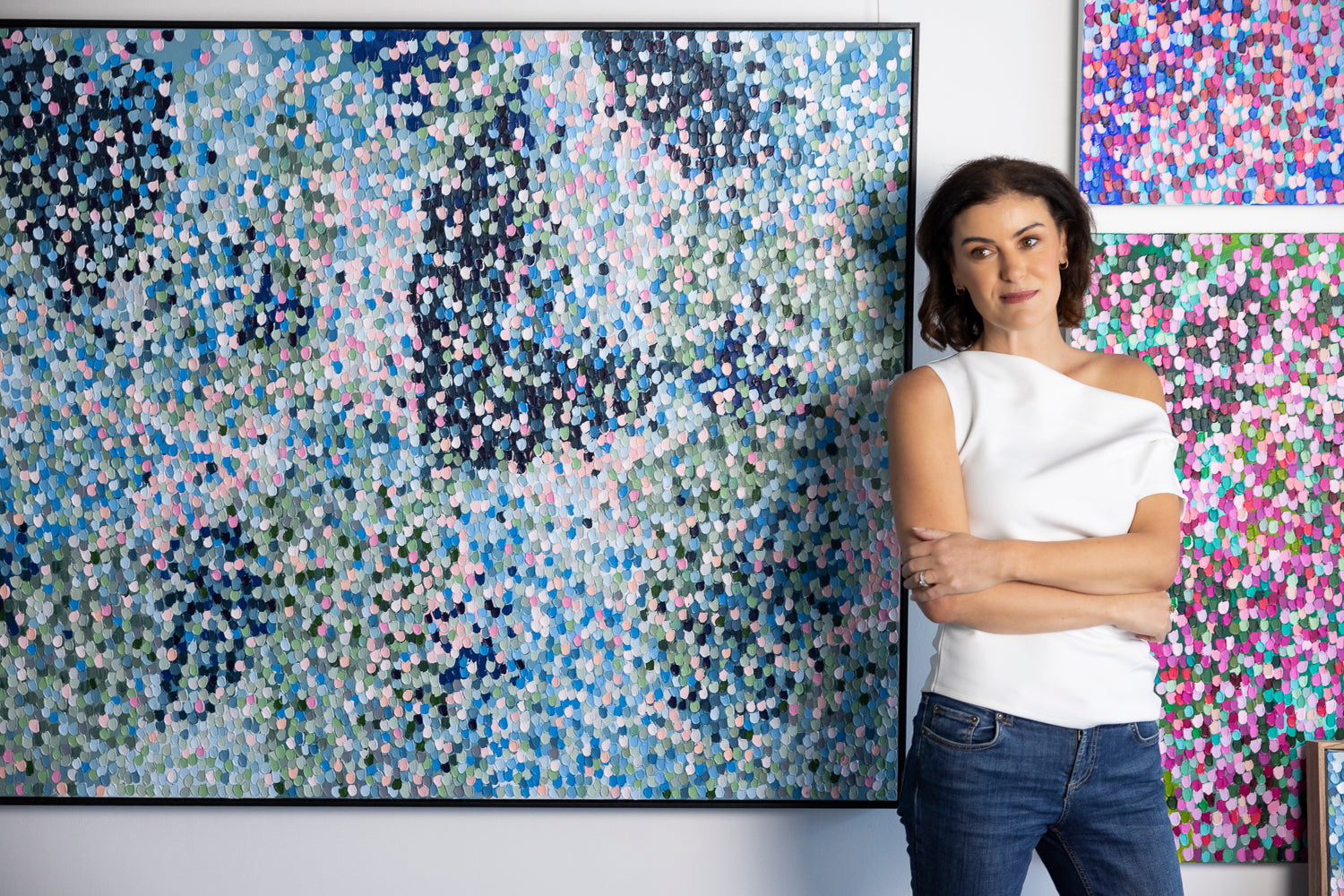 Sabi Klein australian artist in front of painting